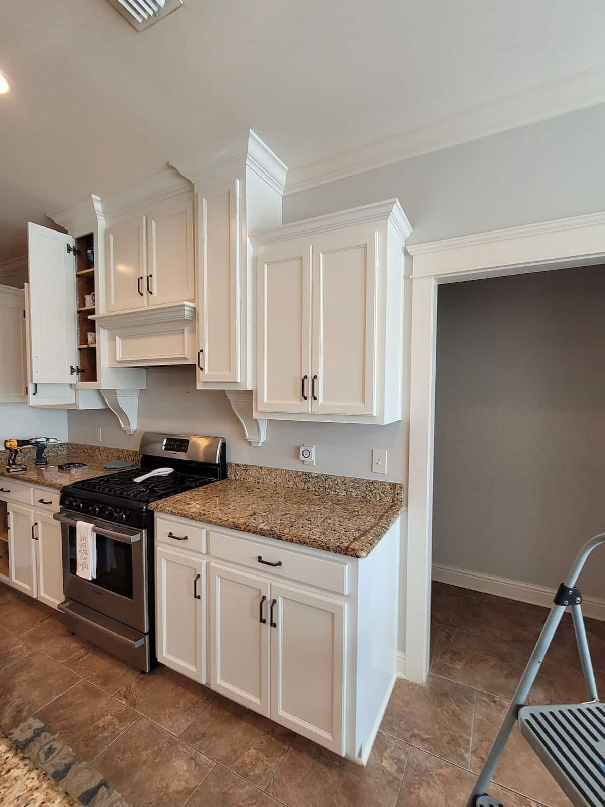 Newly painted kitchen cabinets — factory-grade finish from Pro 1 Painters' climate-controlled drying & preparation booths